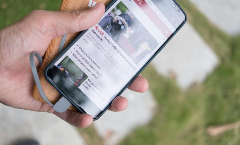 Close-up view of smartphone charging cable and connector on clean white surface