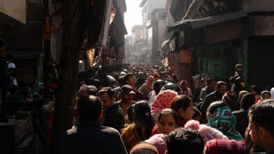 Busy street scene in India showing dense population and urban activity