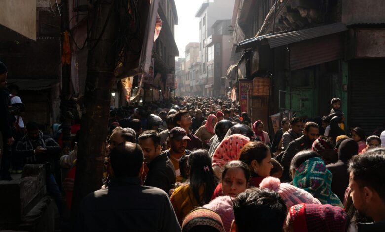 Busy street scene in India showing dense population and urban activity