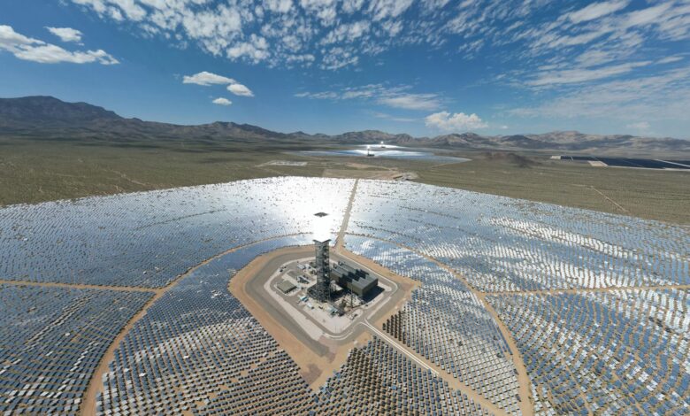 Large-scale solar panel installation in desert landscape under bright sunshine