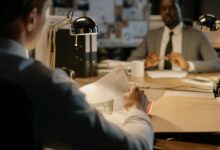 Professional office environment with documents and files representing federal investigation activities