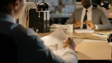 Professional office environment with documents and files representing federal investigation activities