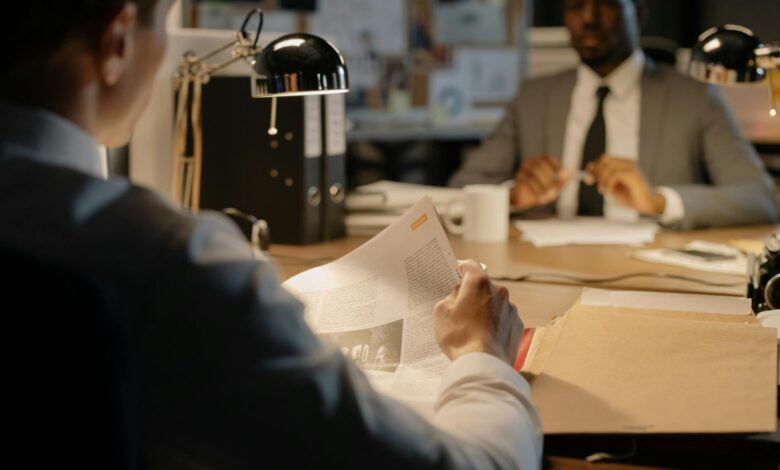 Professional office environment with documents and files representing federal investigation activities