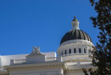 State capitol building dome against blue sky representing state government authority