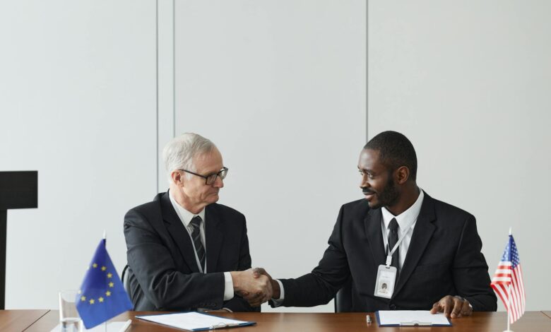 Professional diplomatic meeting room with flags and formal seating arrangement