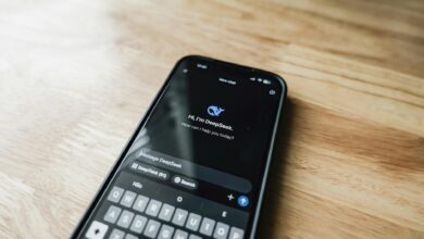 Close-up of smartphone displaying social media apps and notifications on screen