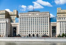 Modern government building with columns representing political leadership and governance