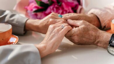 Two elderly hands reaching toward each other, symbolizing the emotional reunions between separated Korean families