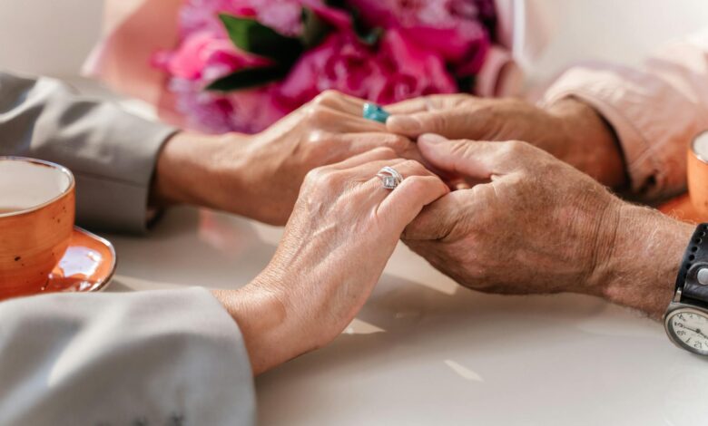 Two elderly hands reaching toward each other, symbolizing the emotional reunions between separated Korean families