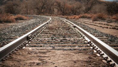 Railroad tracks running through rural countryside area