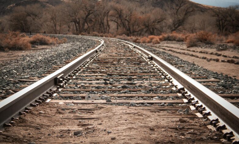 Railroad tracks running through rural countryside area