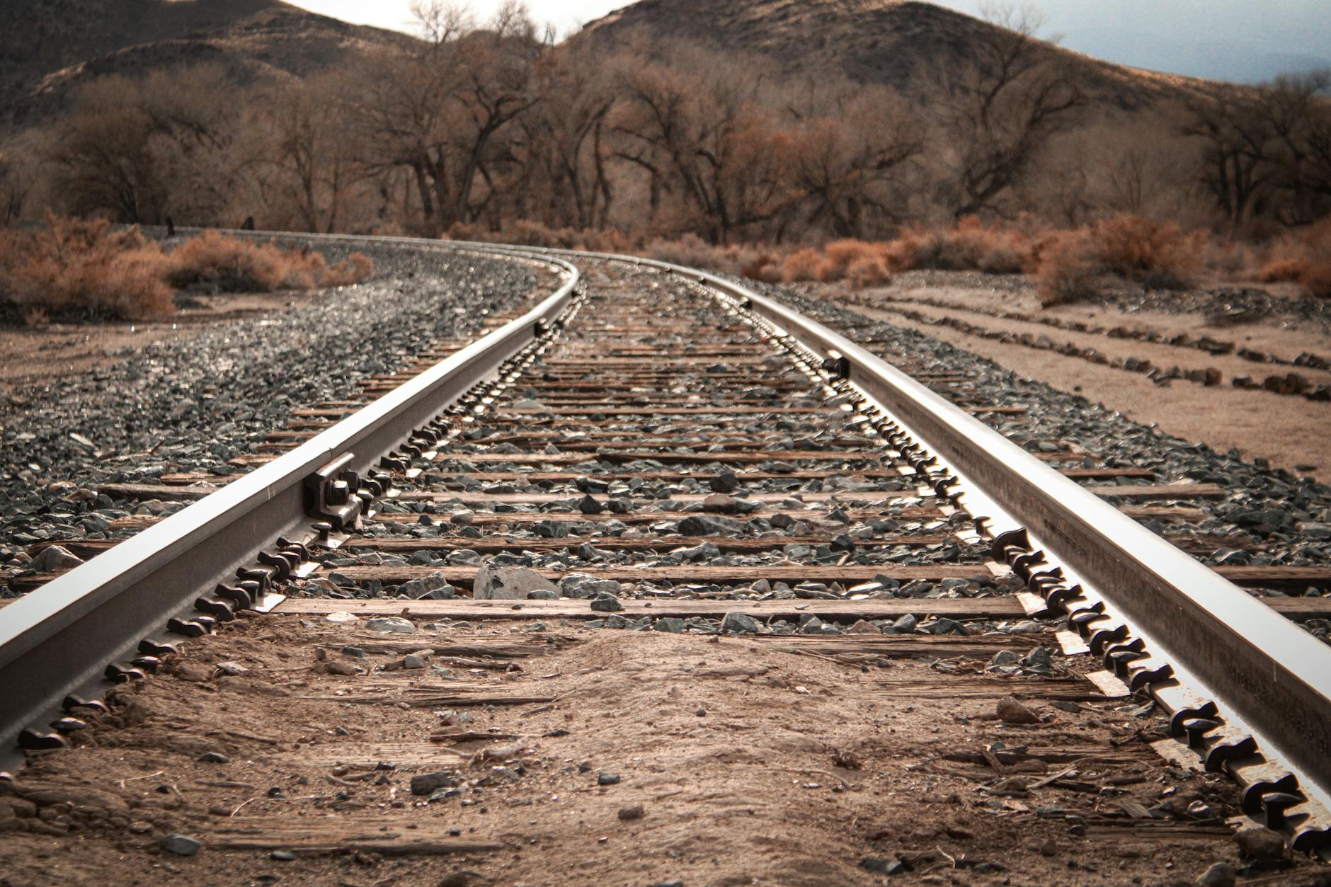 Railroad tracks running through rural countryside area