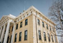Modern courthouse building representing legal proceedings and regulatory investigations
