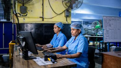 Manufacturing workers in industrial setting representing automotive production workforce