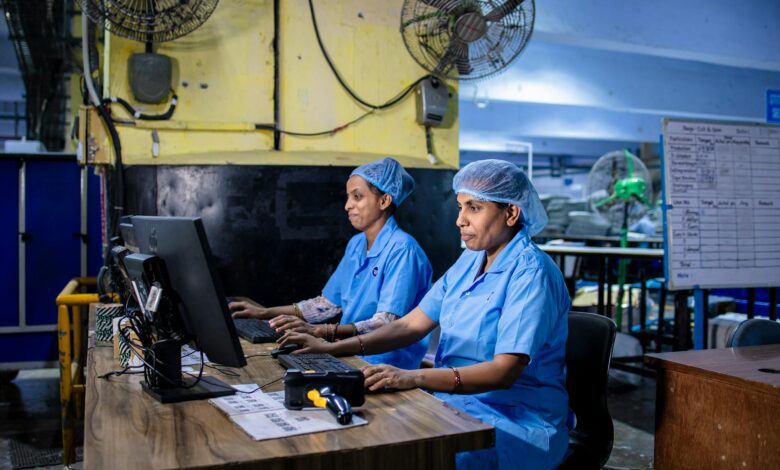 Manufacturing workers in industrial setting representing automotive production workforce