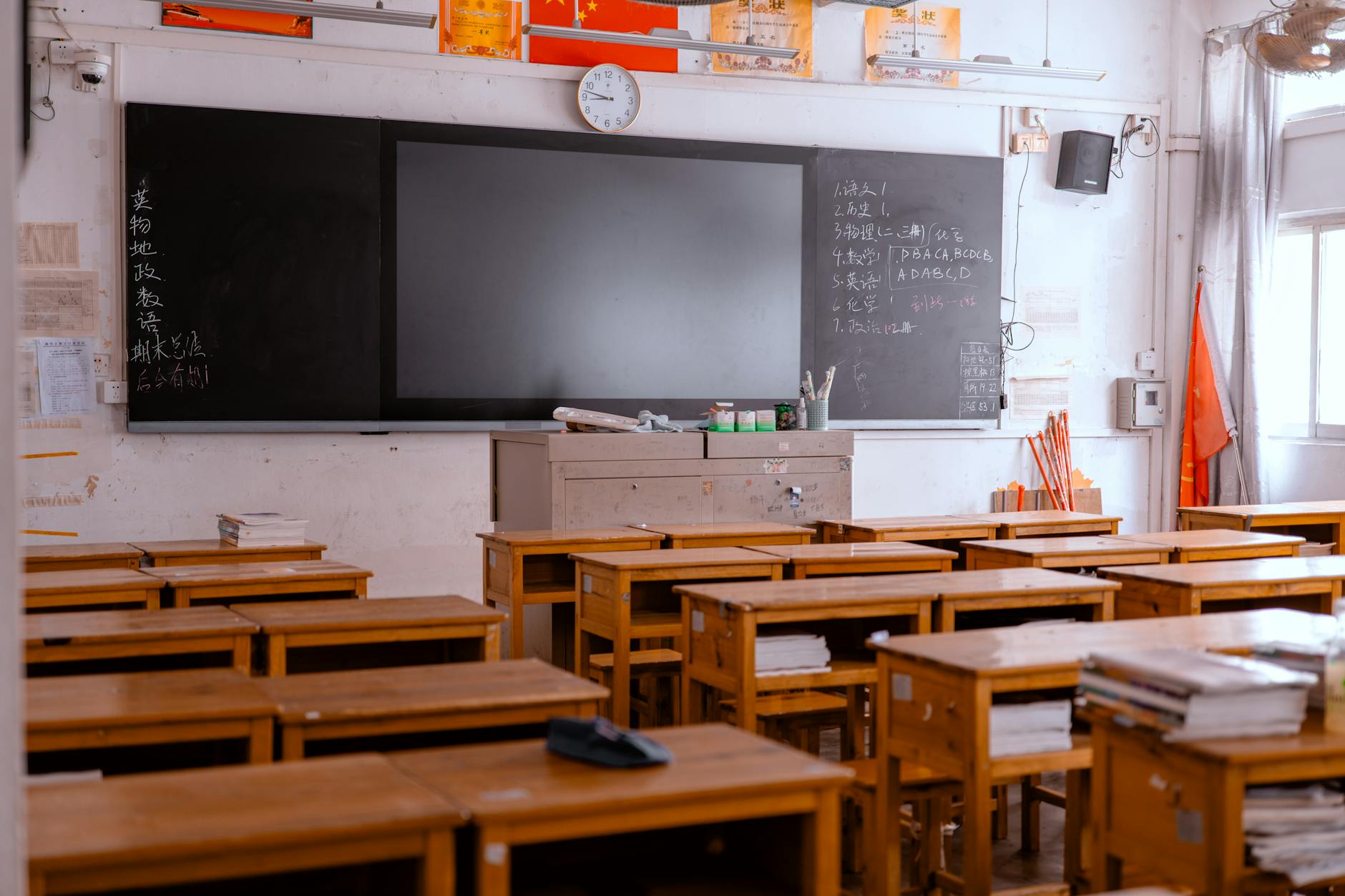 Empty classroom with desks and chairs showing the impact of heat-related school closures