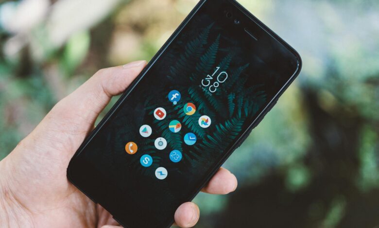 Person using smartphone showing social media interface and engagement metrics