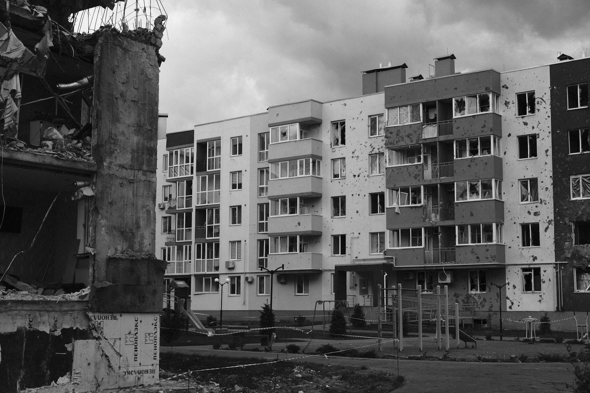 Building showing earthquake damage with cracked walls and structural issues
