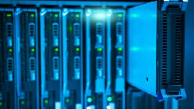 Modern data center server room with rows of computing equipment and blue lighting