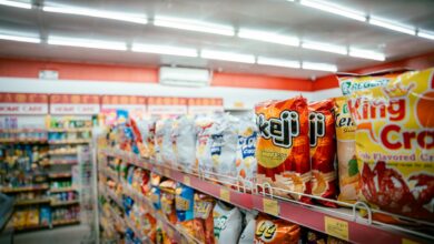 Modern grocery store interior with organized aisles and shopping carts