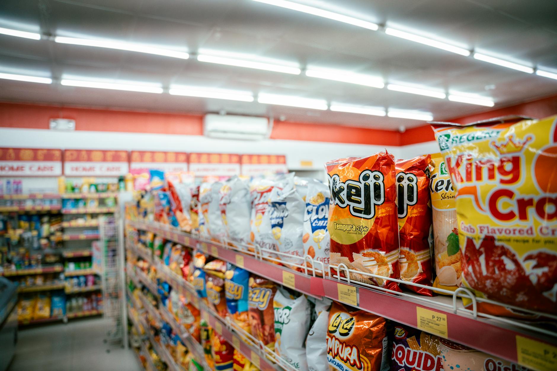 Modern grocery store interior with organized aisles and shopping carts