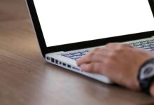 Close-up of computer screen displaying code and programming interface representing AI development