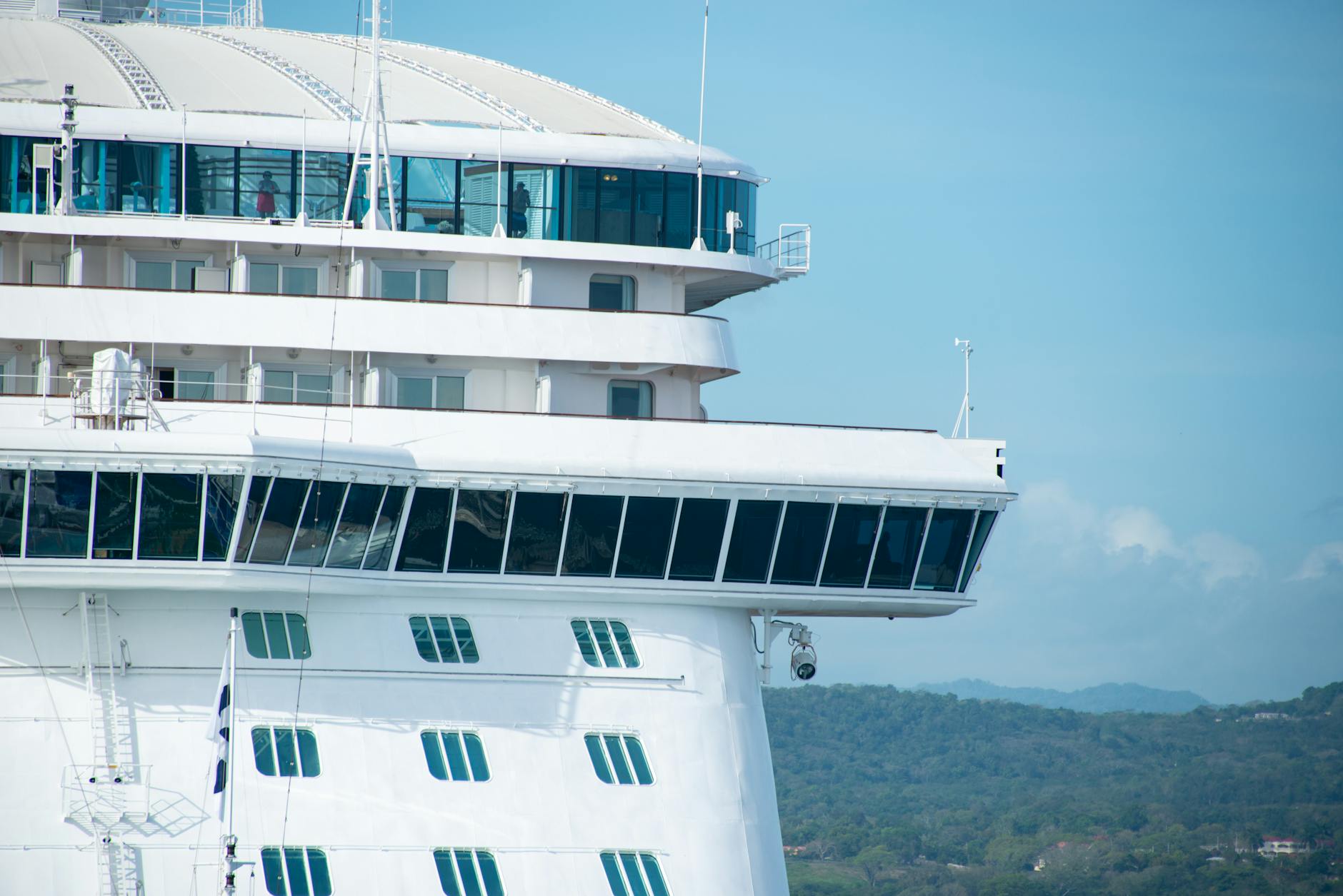 Large cruise ship sailing on calm blue ocean waters