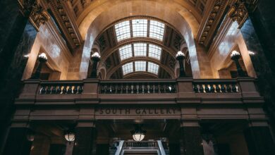 Interior view of government building with columns and formal architecture representing legislative chambers