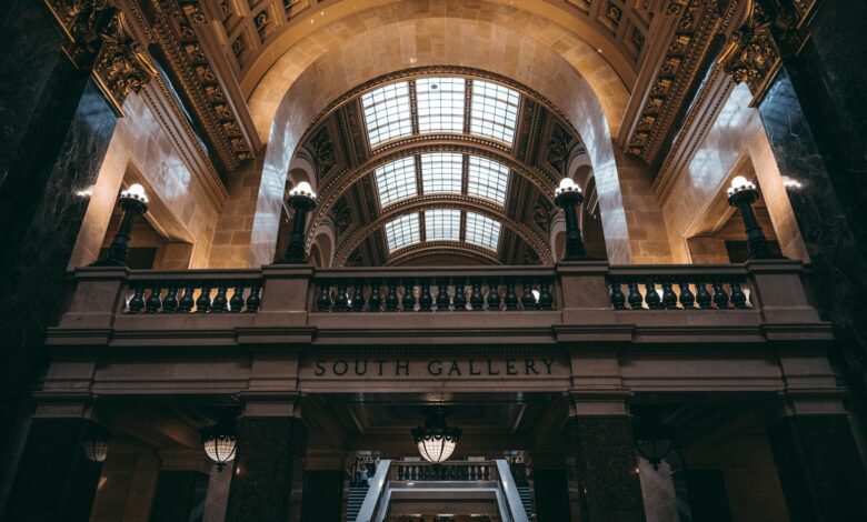 Interior view of government building with columns and formal architecture representing legislative chambers