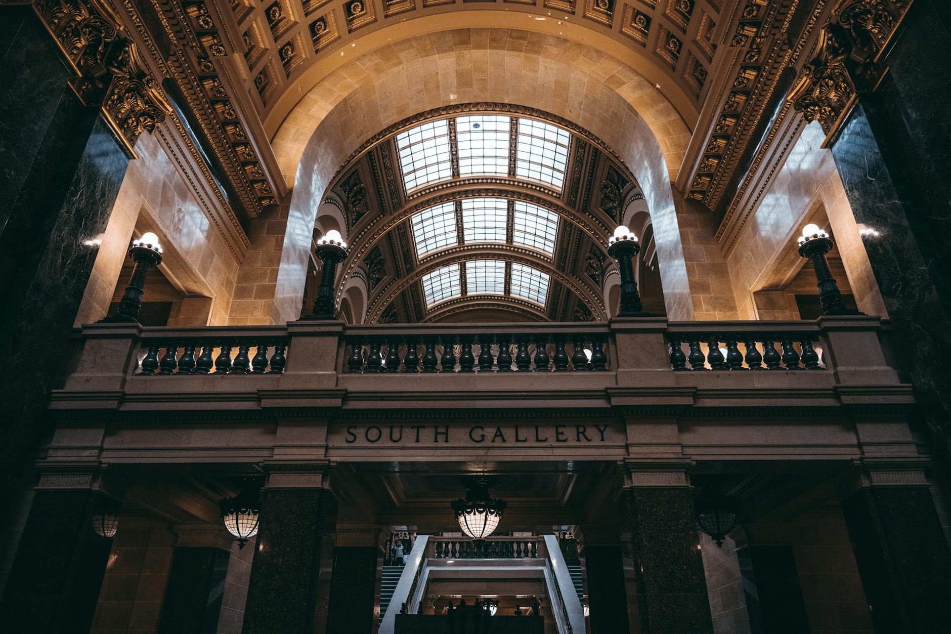 Interior view of government building with columns and formal architecture representing legislative chambers