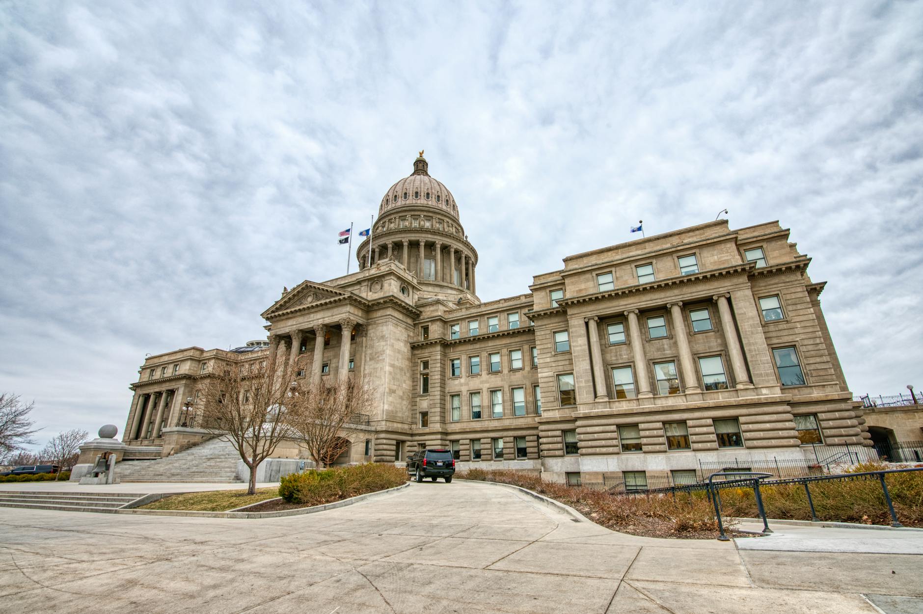 State government building with American flags representing political leadership