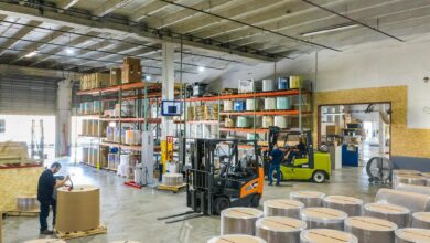 Large warehouse interior with high shelves and shopping carts, representing wholesale retail environment
