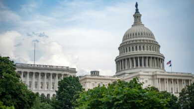 United States Capitol building with blue sky background representing federal legislative action