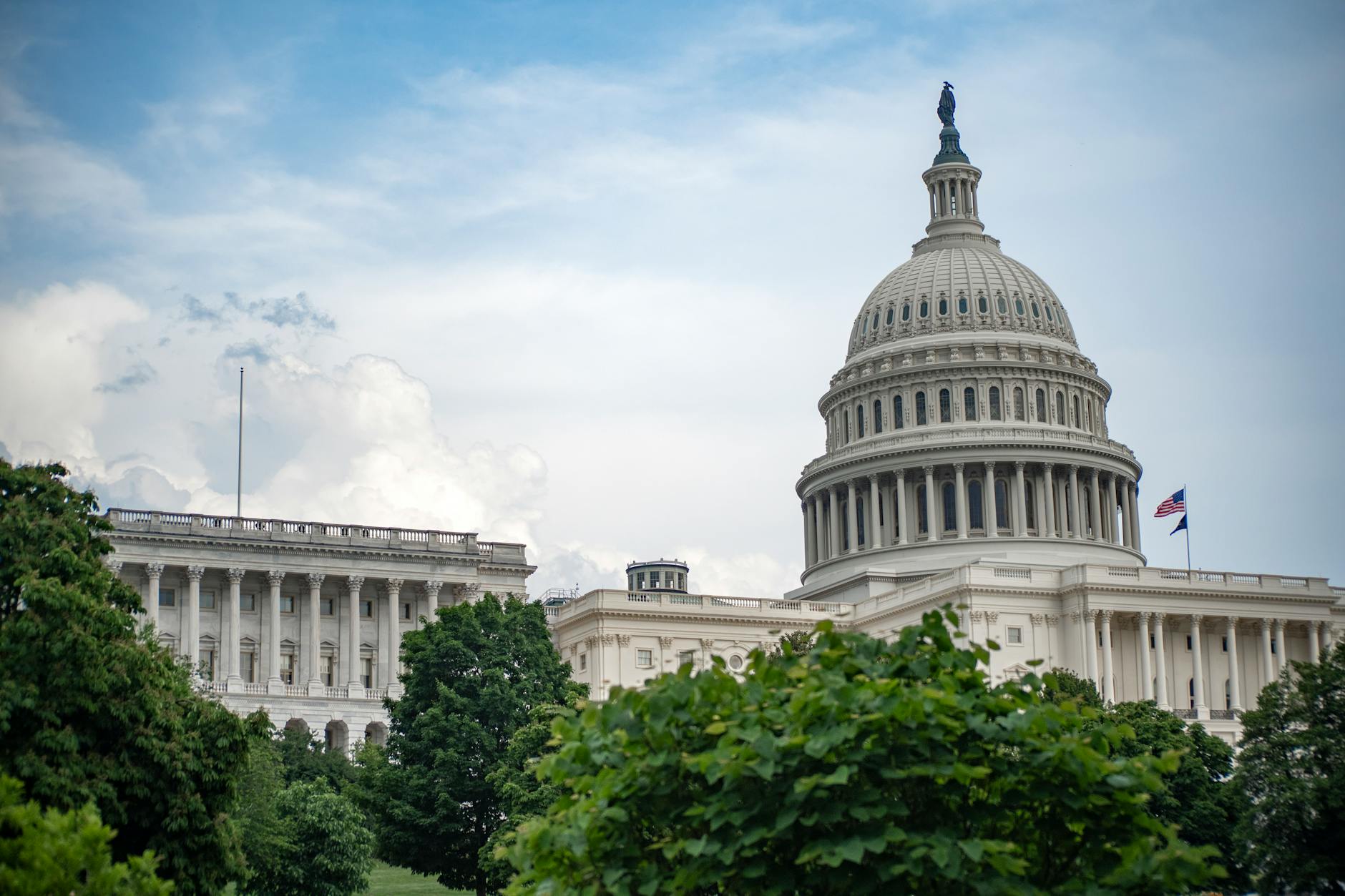 United States Capitol building with blue sky background representing federal legislative action