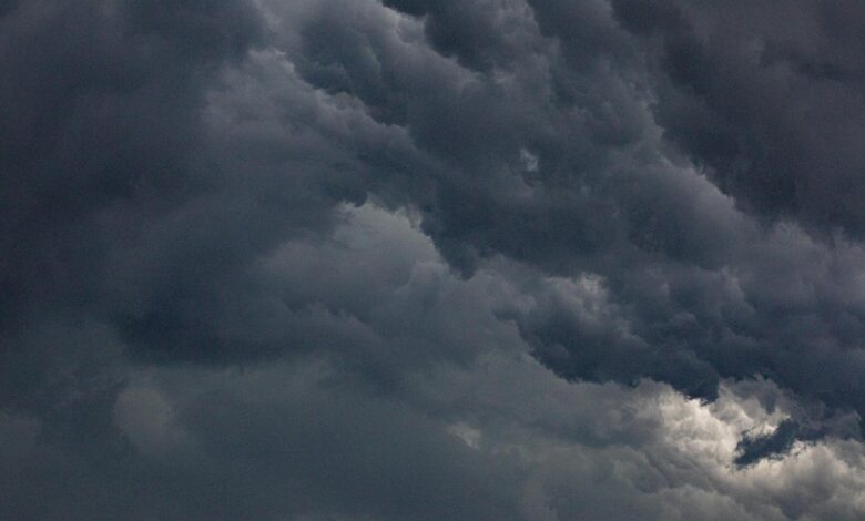 Dark storm clouds gathering in the sky before severe weather outbreak
