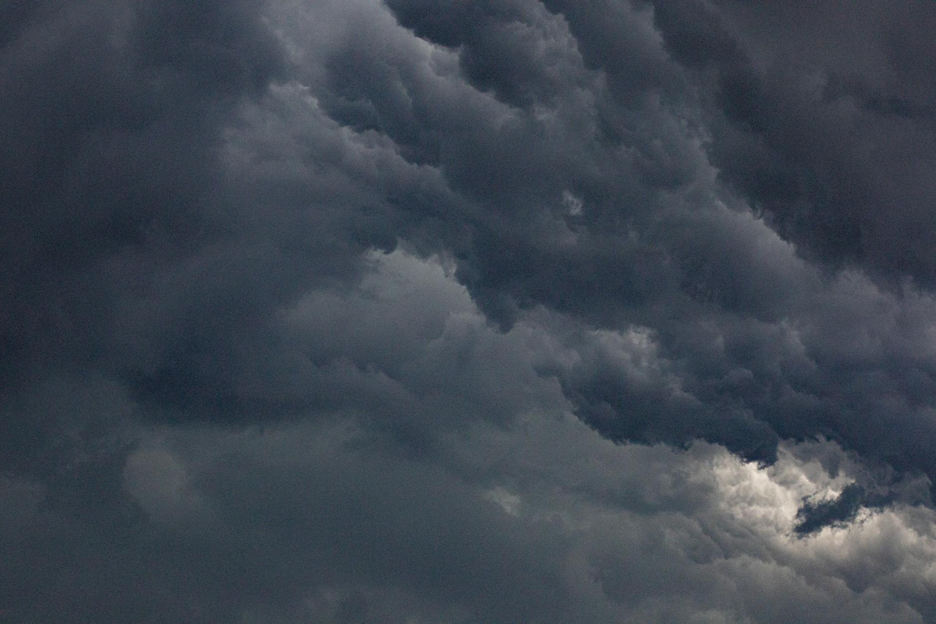 Dark storm clouds gathering in the sky before severe weather outbreak