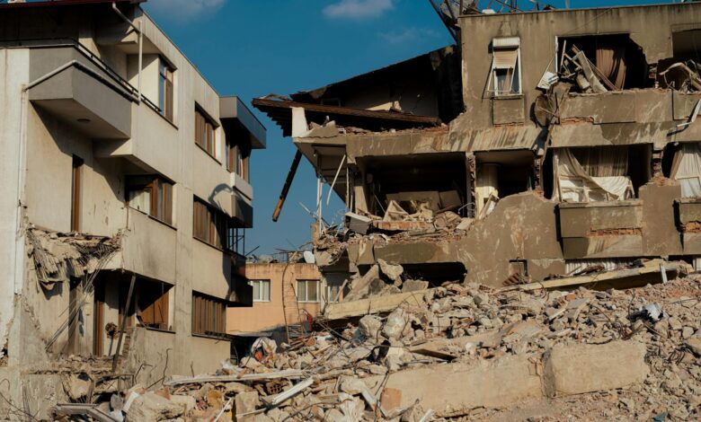 Damaged building structure showing cracks and debris from seismic activity
