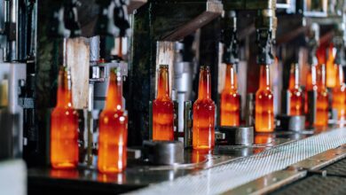 Modern automotive assembly line with robotic equipment and manufacturing stations