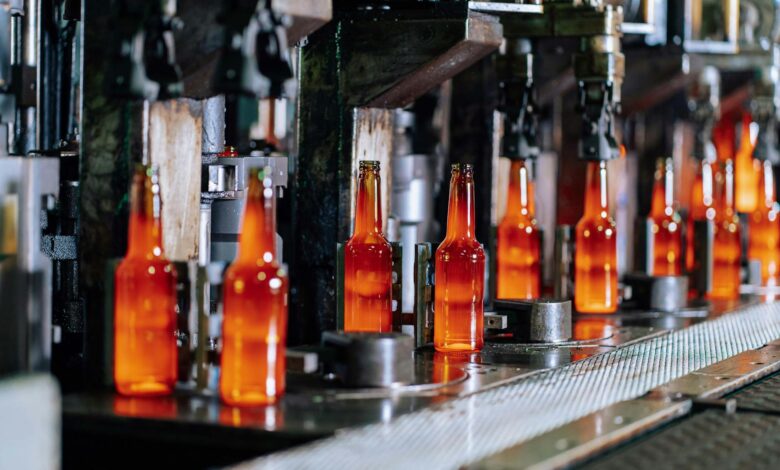 Modern automotive assembly line with robotic equipment and manufacturing stations