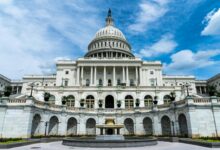 Government building exterior showing classical architecture with columns and dome