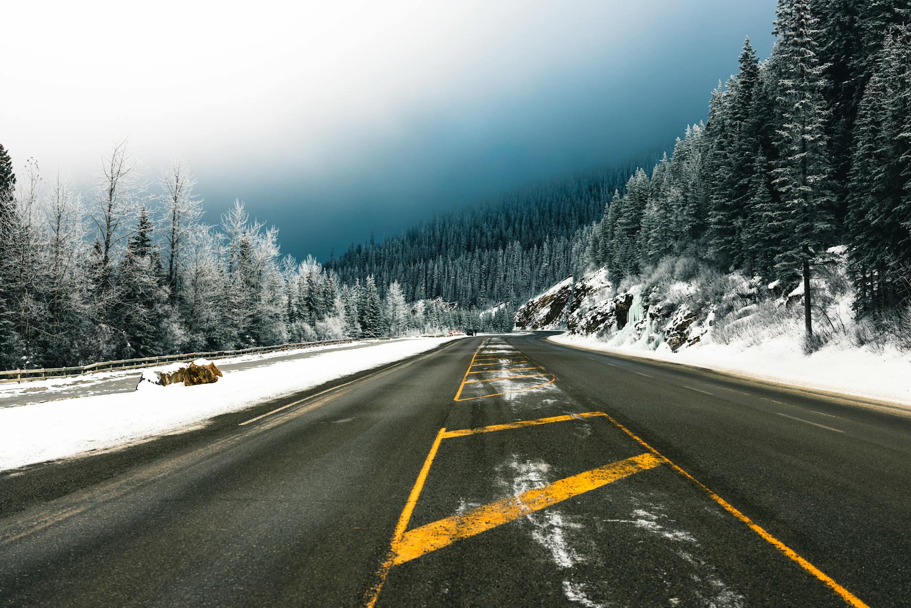 Snow-covered interstate highway with limited visibility and dangerous driving conditions