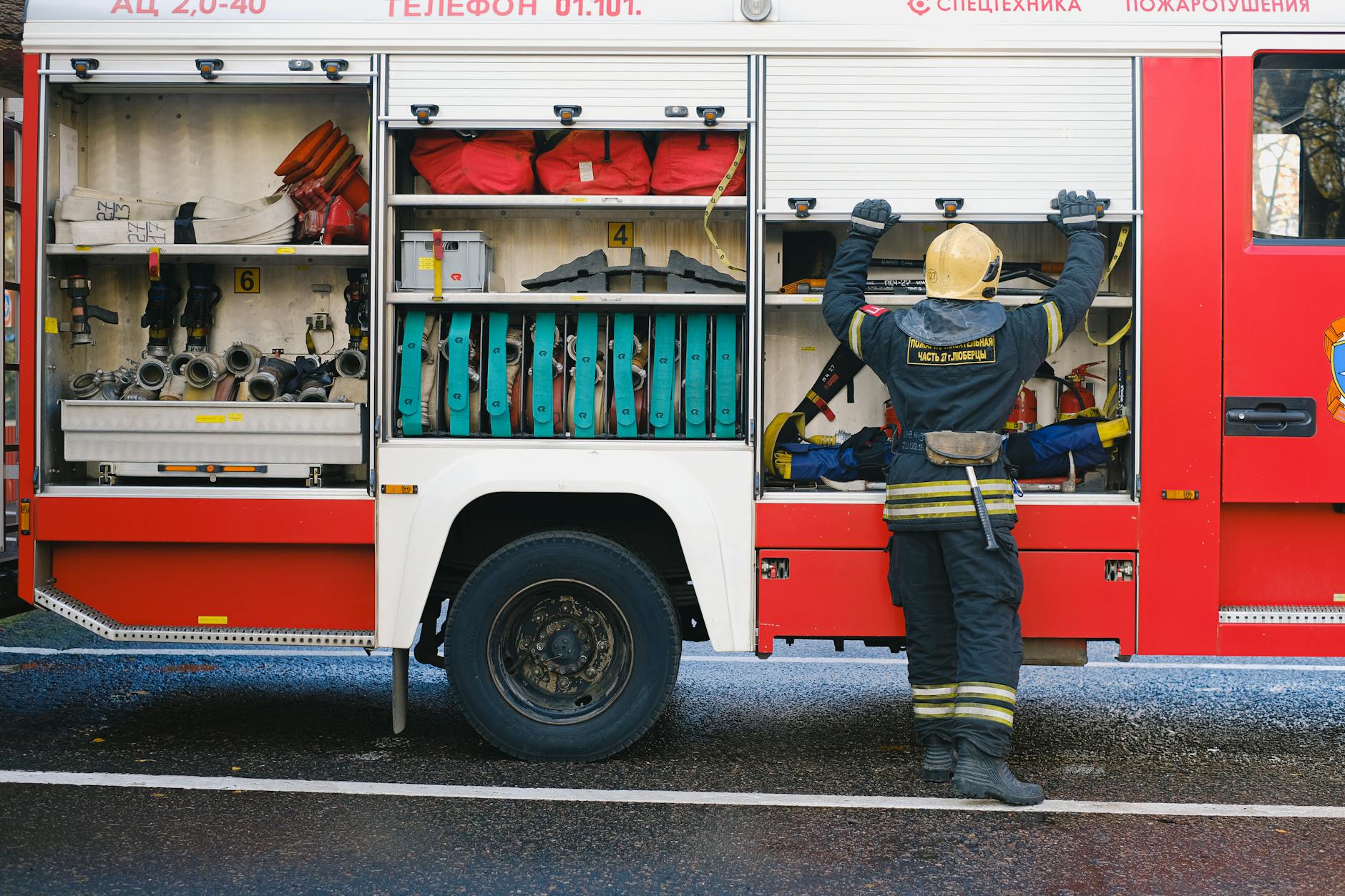 Emergency response personnel with monitoring equipment at industrial incident scene