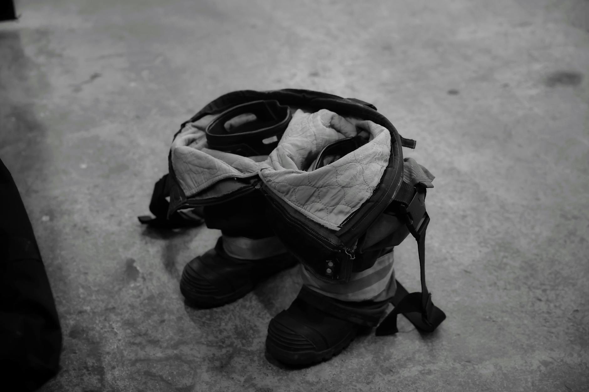 Fire department trucks and emergency equipment stationed outside industrial building