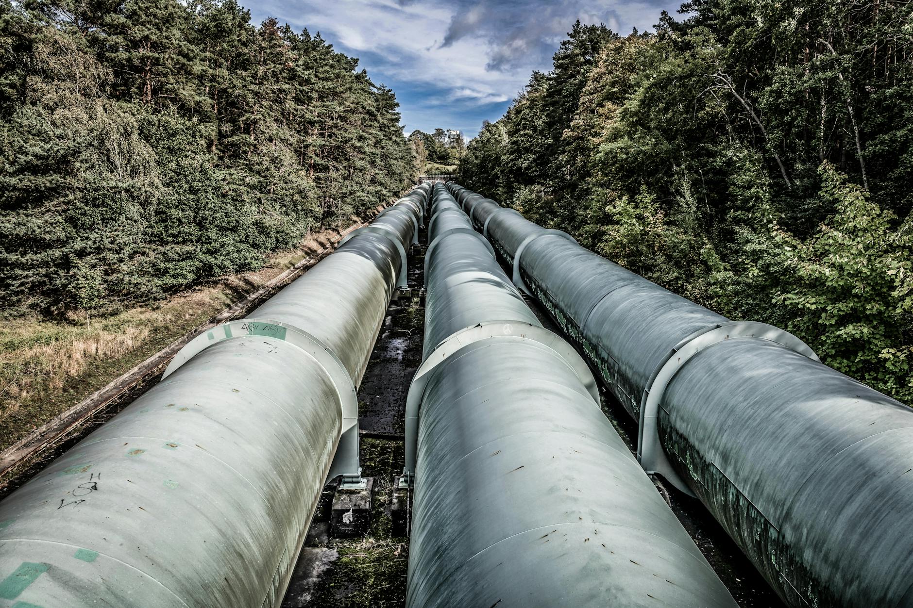 Large oil pipeline running through rural landscape