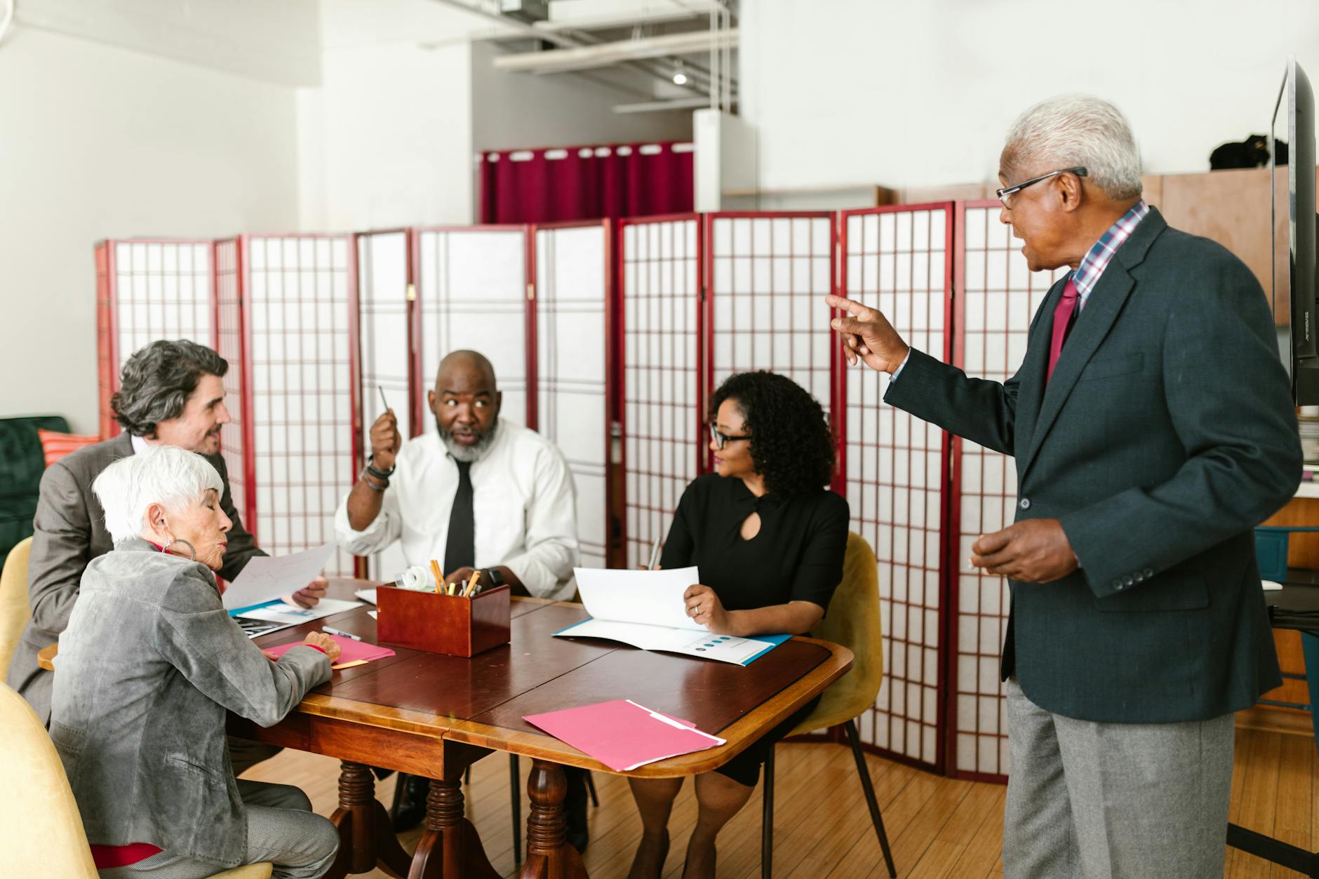 International business professionals collaborating in modern conference room