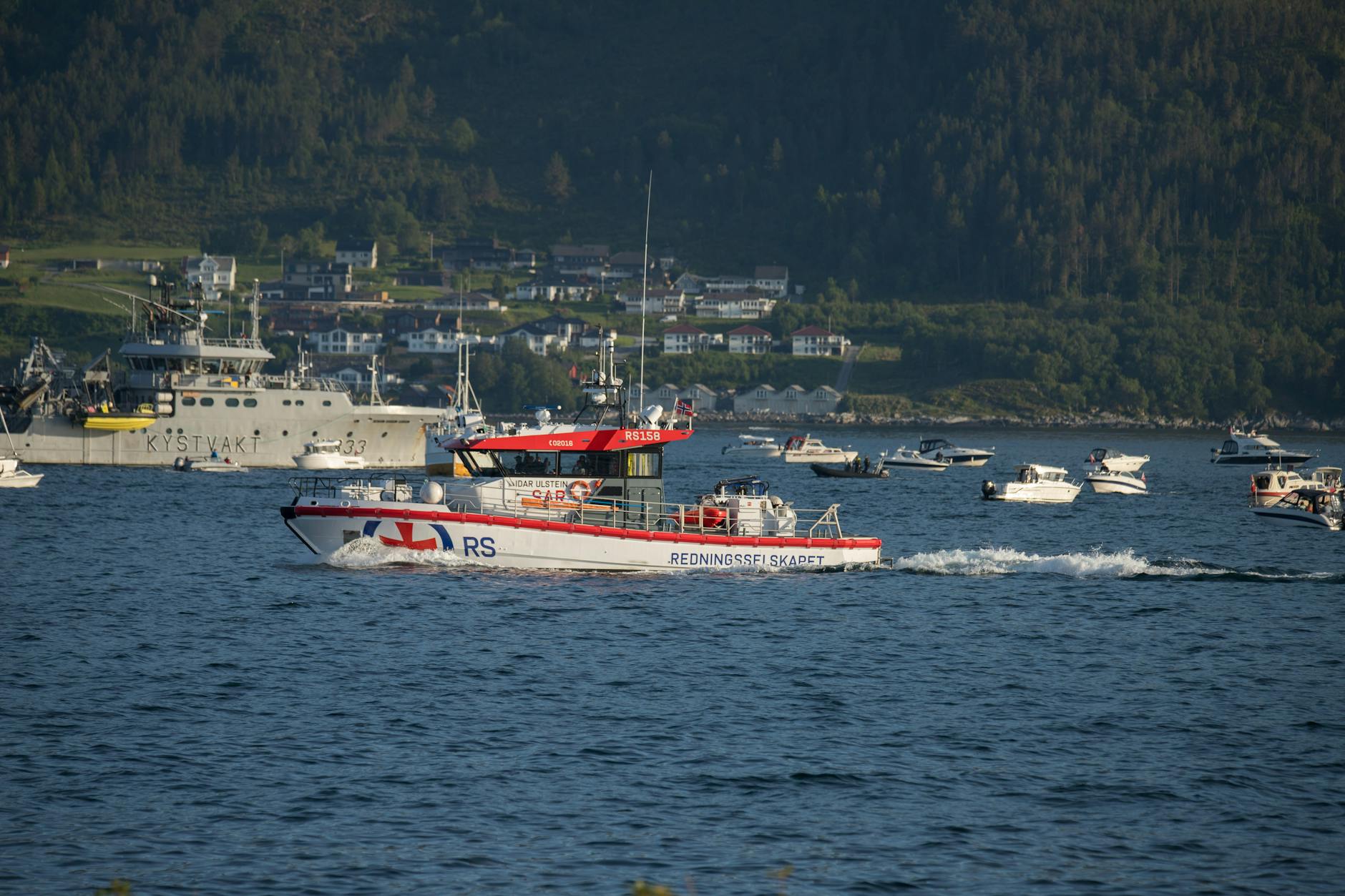 Emergency rescue boat navigating through flood waters during disaster relief operations