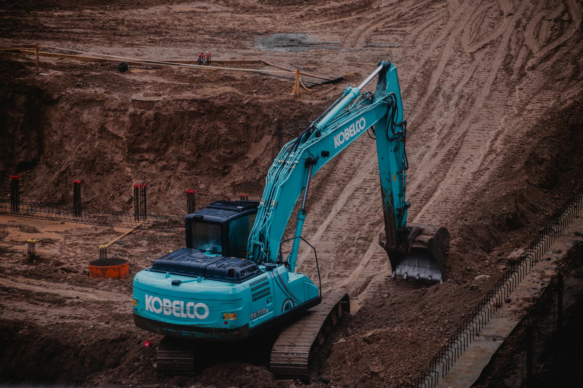 Heavy construction equipment working on large-scale excavation project