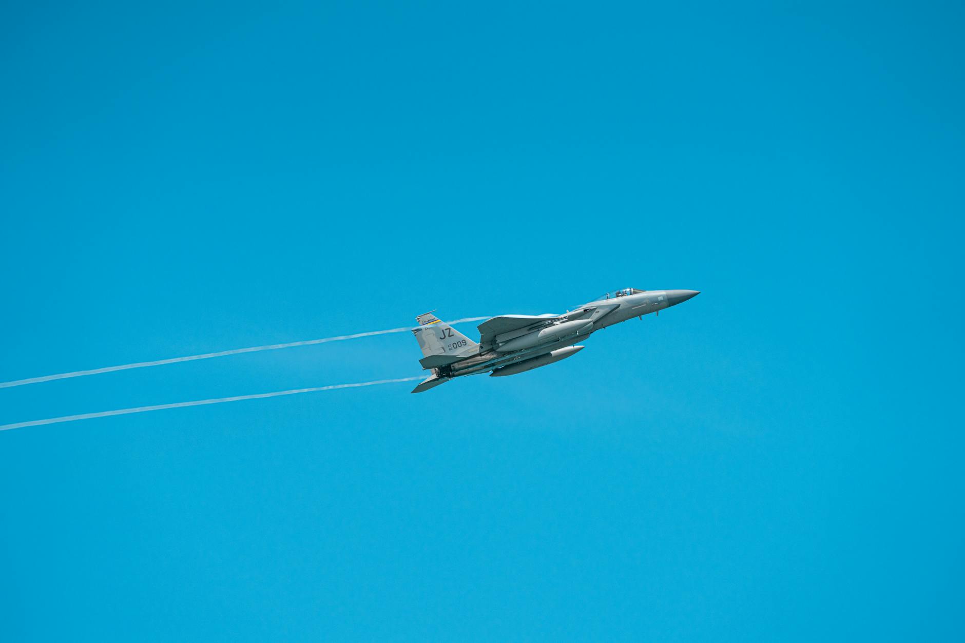 Military aircraft flying in formation during aerial operations
