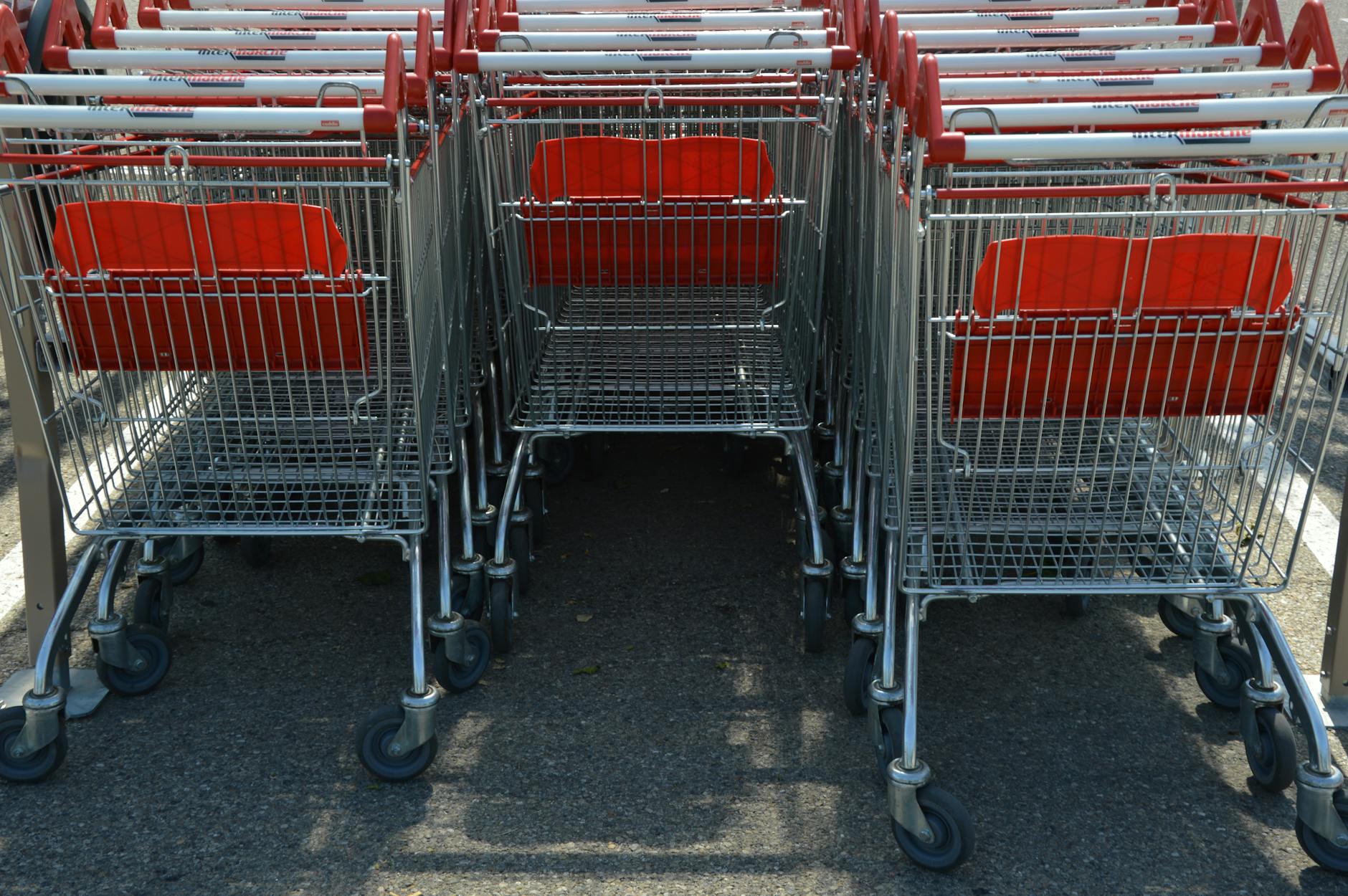 Shopping cart in grocery store aisle showing typical retail shopping experience