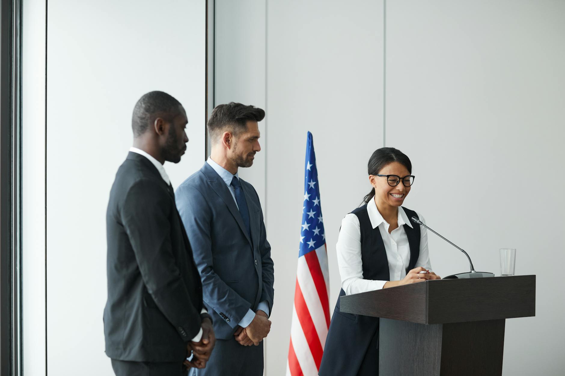 American flag behind empty podium representing presidential campaign preparations